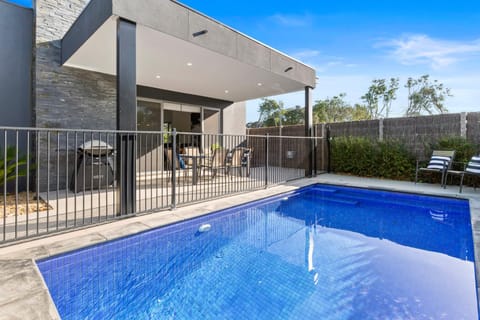Property building, BBQ facilities, Dining area, Swimming pool