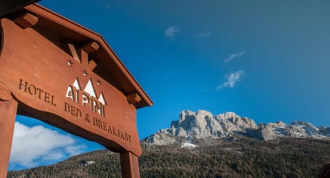 Property building, Day, Property logo or sign, Natural landscape