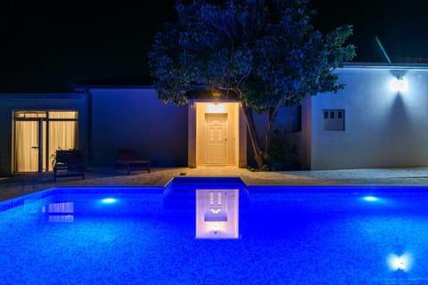 Property building, Patio, Facade/entrance, Night, Pool view, Swimming pool