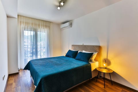 Bed, Bedroom, City view, wardrobe, air conditioner