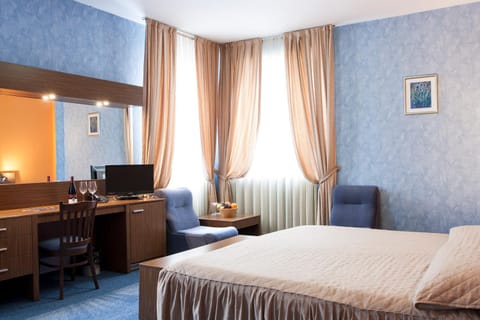 Bed, TV and multimedia, Seating area, Bedroom, hair dresser
