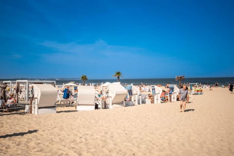 Nearby landmark, People, Natural landscape, Beach, sunbed
