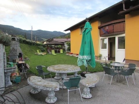Property building, Patio, Facade/entrance, Day, Natural landscape, BBQ facilities, Seating area, Dining area, Mountain view, sunbed
