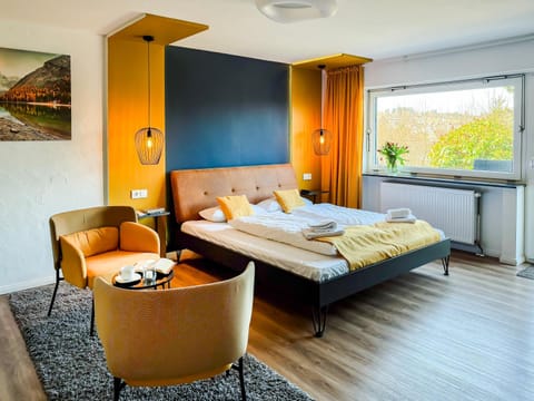 Bed, Seating area, Bedroom