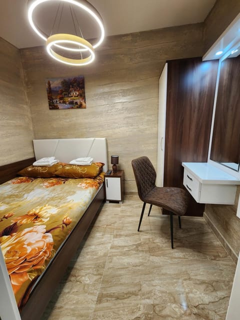 Bed, Living room, Photo of the whole room, Seating area, Bedroom, hair dresser, wardrobe