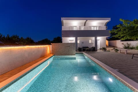 Property building, Patio, Night, Pool view, Swimming pool, sunbed