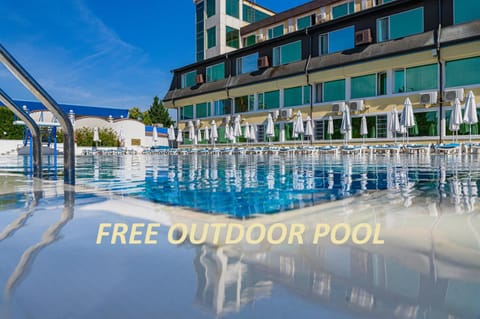 Property building, Day, Text overlay, Pool view, Swimming pool