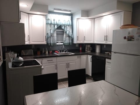 Kitchen or kitchenette, dishwasher, oven, stove, toaster