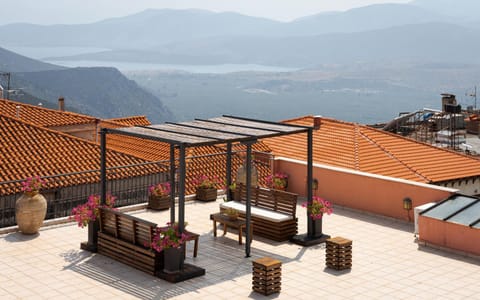 Property building, Patio, Nearby landmark, Day, Natural landscape, View (from property/room), Balcony/Terrace, Mountain view