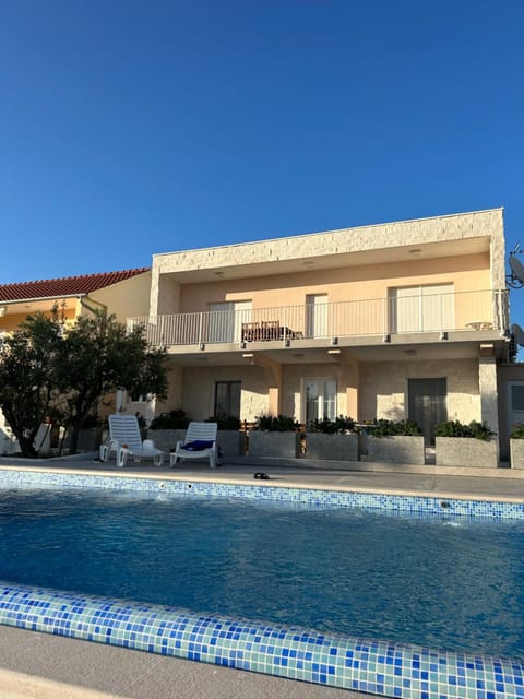 Property building, Pool view, Swimming pool, sunbed