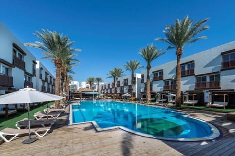 Property building, Patio, Communal lounge/ TV room, Spring, Day, Evening entertainment, Pool view, Swimming pool, sunbed