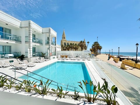 Property building, Natural landscape, Pool view, Sea view, Swimming pool, sunbed