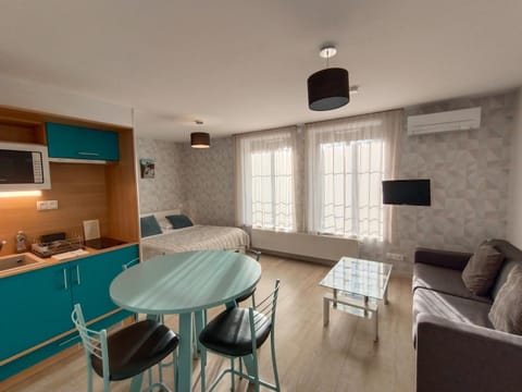 Kitchen or kitchenette, microwave, stove, kitchen, air conditioner