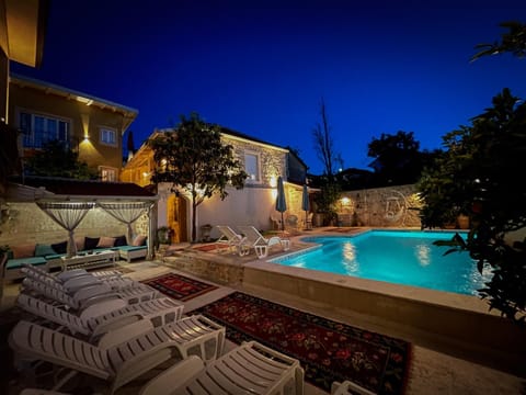 Property building, Patio, Night, Pool view, Swimming pool