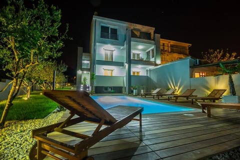 Property building, Patio, Facade/entrance, Night, Garden, View (from property/room), On site, Swimming pool