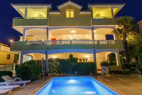 Property building, Facade/entrance, Night, Lobby or reception, Area and facilities, Swimming pool