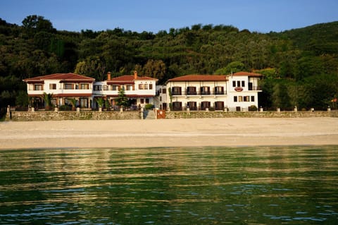 Property building, Day, Natural landscape, Beach, Sea view