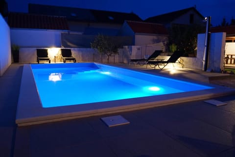 Property building, Night, Pool view, Swimming pool, Swimming pool, sunbed