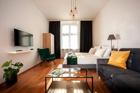 Bed, TV and multimedia, Living room, Seating area, Inner courtyard view