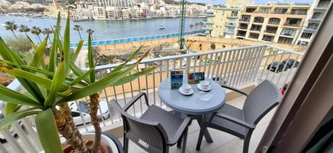 Property building, Patio, Natural landscape, View (from property/room), Balcony/Terrace, Dining area, City view, Sea view