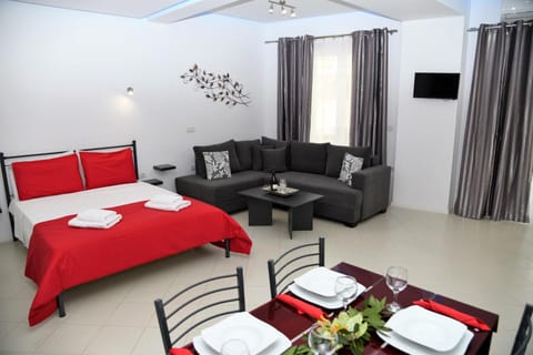 Bed, TV and multimedia, Living room, Seating area, Dining area
