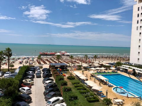 Property building, Nearby landmark, Natural landscape, Bird's eye view, View (from property/room), Beach, Evening entertainment, Pool view, Sea view, Swimming pool, Location, sunbed