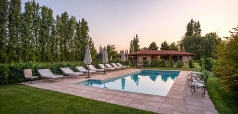 Property building, Patio, Day, Natural landscape, Garden, Garden view, Pool view, Swimming pool