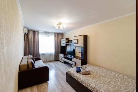 Bed, TV and multimedia, Seating area, Bedroom, furniture, furniture, towels, towels, air conditioner