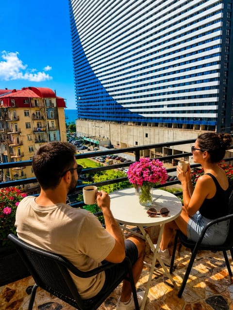 Property building, Patio, Day, People, View (from property/room), Balcony/Terrace, Living room, Seating area, Guests, City view, group of guests