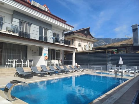 Property building, Pool view, Swimming pool, sunbed