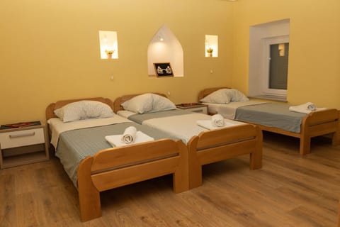 Bed, TV and multimedia, Seating area, Bedroom, towels, wardrobe, air conditioner
