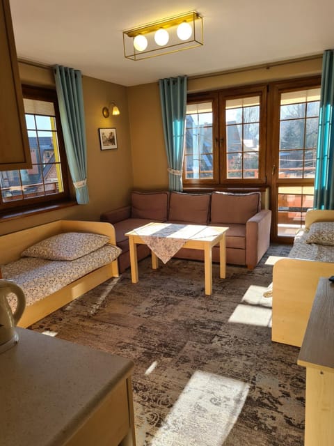 Bed, Living room, Seating area, Bedroom