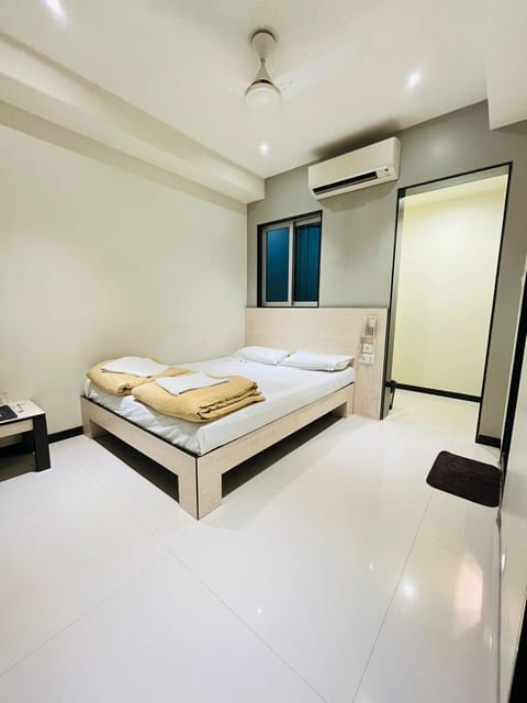 Bed, Photo of the whole room, Bedroom, towels, air conditioner