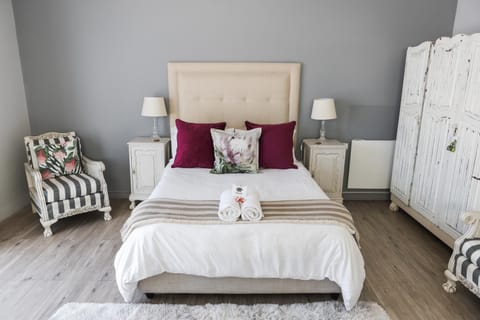 Bed, Decorative detail, Seating area, Bedroom, towels, wardrobe