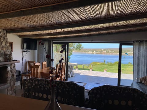 View (from property/room), Balcony/Terrace, Living room, Seating area, Dining area, River view