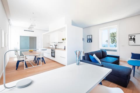 View (from property/room), Living room, Seating area, Dining area, Sea view