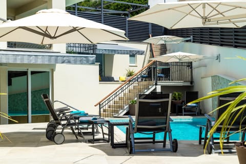 Property building, Patio, Day, Balcony/Terrace, Seating area, Pool view, Swimming pool, Swimming pool, sunbed