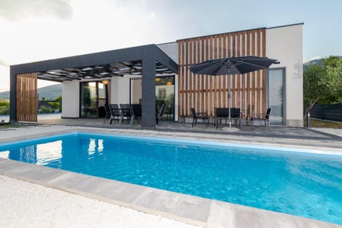 Property building, Patio, Day, Pool view, Swimming pool