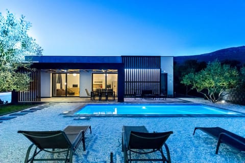 Property building, Patio, Night, Natural landscape, Pool view, Swimming pool, sunbed