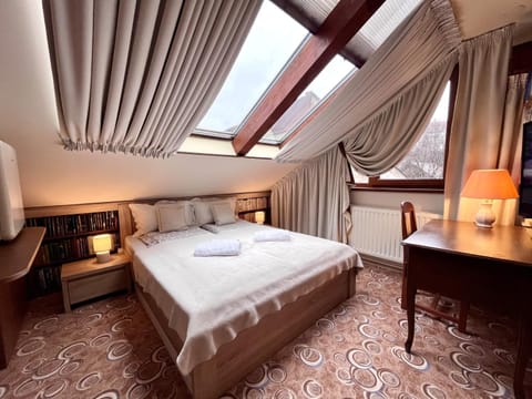 Bed, Library, View (from property/room), Seating area, Bedroom