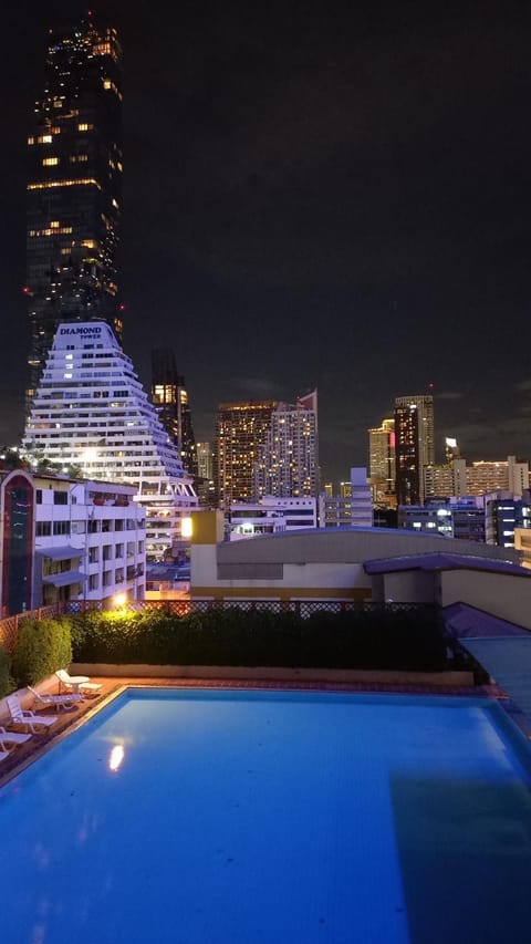 Night, View (from property/room), City view, Pool view, Swimming pool