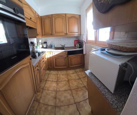 Kitchen or kitchenette, dishwasher, oven, stove, toaster