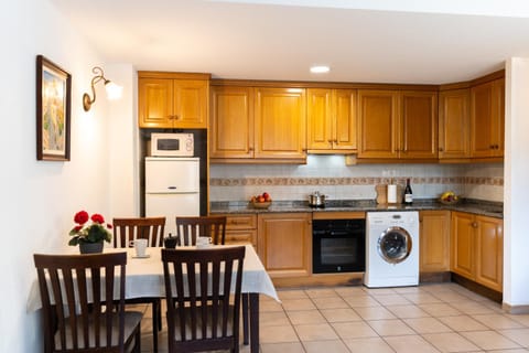 Kitchen or kitchenette, oven, stove, toaster, washing machine, dryer