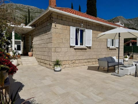 Property building, Patio, Day, Natural landscape, Seating area