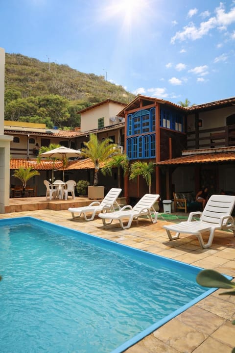 Property building, Patio, Day, Natural landscape, Pool view, Swimming pool, sunbed