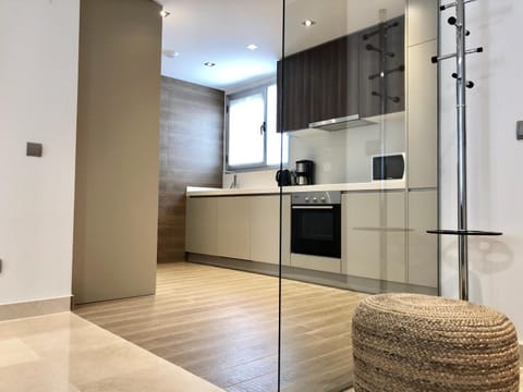 Kitchen or kitchenette, dishwasher, oven, stove