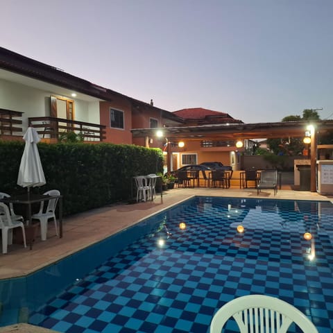 Property building, Patio, Pool view, Swimming pool, sunbed