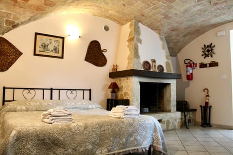 Bedroom, fireplace, furniture, towels