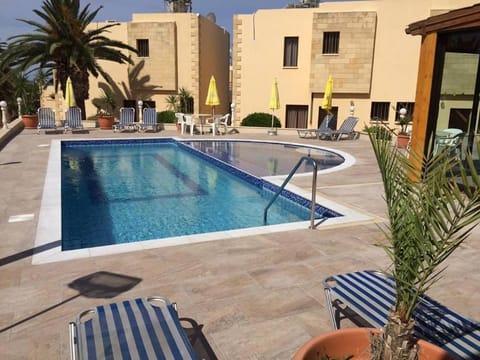 Property building, Patio, Day, Pool view, Swimming pool, sunbed
