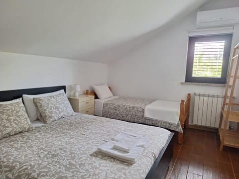 Bed, Photo of the whole room, Bedroom, towels, air conditioner